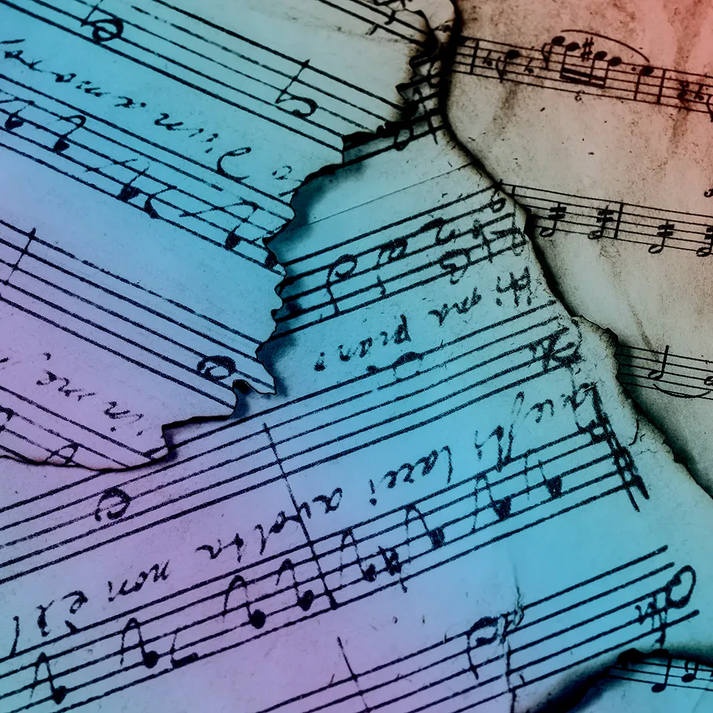 Scraps of antique sheet music with ragged edges, tinted all colours of the rainbow